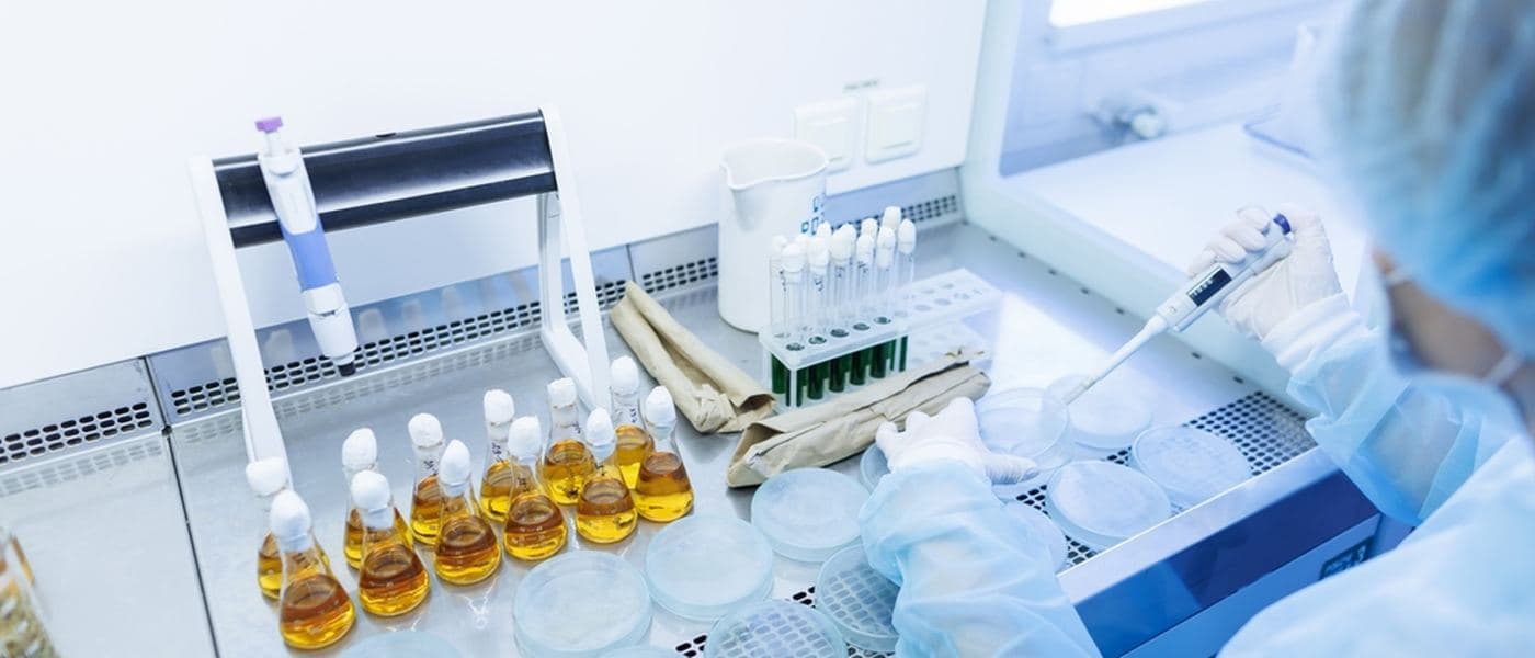Amber sample vials in a rack on an analytical laboratory bench.